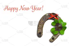 贺年卡马蹄铁和幸运三叶草孤立在白色的背景