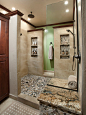 Inspiration for a large timeless master beige tile and porcelain tile porcelain floor alcove shower remodel in Phoenix with beige walls, raised-panel cabinets, dark wood cabinets, a vessel sink and granite countertops