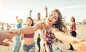 Group of friends having fun and dancing on the beach by Cristian Negroni on 500px