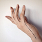 Buzzy hand seam - tattooed by Lusi #handtattoo #fingertattoo #btattooing #linework #darkartists #equilattera