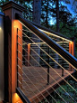 Feeney LED Lighting for DesignRail®: Feeney's custom designed LED lights and Lens installed in stair railing and deck railing. Detail shows 150 CapRail on stair railing, 200 CapRail on level railing. CableRail Quick-Connect® fittings used.