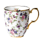 The 1940 English Chintz 2-Tier Mug is decorated in a rich tapestry of roses, forget-me-nots and violets on daintily designed fine bone china.
