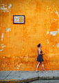 woman walking on sidewalk