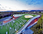 Sloping Green Roof Tops Submerged Multipurpose Hall on Jeju Island: 