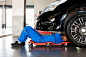 Mechanic working on car in garage