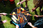 People Barbecuing Skewered Meats