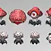 This may contain: some red mushrooms with white dots on them and one has an eye in the middle