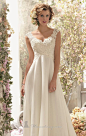 Imagine the radiant bride you will be in 6778 by Voyage by Mori Lee. This flowing empire wedding gown is made of Alencon lace and chiffon. T...