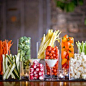 A twist on the veggie tray. Great use of dollar store vases.