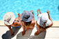 年轻女子太阳帽坐池畔度假村游泳池暑假照片素材