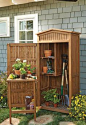 This charming storage cabinet keeps your short- and long-handled tools, potting supplies and other