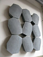 Really beautiful and simple concrete wall panel / sculpture. It's like an abstraction of boulders.