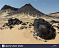 shiny-black-volcanic-rock-strewn-over-the-sand-in-the-black-desert-A9CWED.jpg (1300×1065)