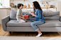 mom-son-celebrate-birthday-together-happy-mum-excited-son-sit-couch-hold-gifts-smiling_165285-3966