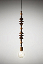 悉尼工作室Marz Designs的串珠吊灯（Bright Beads Pendant Lights），每一盏光亮的灯泡，搭配手工制作的澳大利亚硬木装饰物，风格古朴，灯影间，一段现代与古典的邂逅。