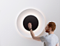 lunaire eclipse wall lamp by ferreol babin for fontana arte - designboom | architecture & design magazine : the wall lamp for fontana arte illuminates with a surprising effect: a glow reminiscent of the phenomenon produced by eclipses.