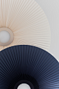 CARMEN — PAULINEPLUSLUIS : C A R M E N Hartô, 2018 Carmen is a ceiling lamp made of a pleated fabric corolla that surrounds a luminous disc. The pleated fabric is used for its...