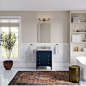 Transitional white tile mosaic tile floor, white floor and single-sink freestanding bathtub photo with shaker cabinets, blue cabinets, beige walls, an undermount sink, marble countertops, gray countertops and a freestanding vanity