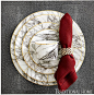 Get this marbled look: “Keon” napkin ring in tarnished silver. “Elini” marble-inspired porcelain dinnerware with gold edge. “Henry” faux shagreen square placemat in cool gray. All from Blue Pheasant.  - Photo: Marty Baldwin: 