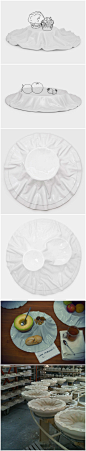 葡萄牙产品设计师Gonçalo Campos为陶瓷和水晶厂商Vista Alegre设计了一种陶瓷桌布浅盘，盘子表面有布的褶皱，看上去像是一块柔软的桌布盖在碗上，用来摆放食物。这款盘子的灵感正是源于桌布，设计师表示通常桌布都是配角，制造一种气氛，让人对盖在里的东西产生期待。设计师希望通过该设计让人们多留意身边的简单物品，体会其中蕴含的细节之美。