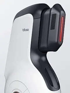 the back side of a white and black object with red light coming out of it
