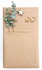 kraft paper giftwrap ideas - Create a fold below wrapping to create a pocket to tuck a card into.
