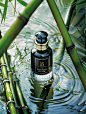 Product_photography_A_bottle_of_black_bamboo_perfume_is__26ab7411-9ba4-4fd8-95dc-baecdb98e88a