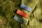Roam speakers in Olive, Sunset, and Wave on grass