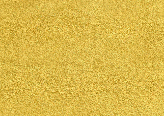 亮黄色皮革纹理背景图片