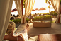 Caucasian woman relaxing in cabana on tropical beach by Gable Denims on 500px