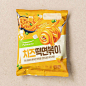 This may contain: a bag of orange noodles on a white surface with the words pulmonoe written in korean