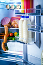 Open refrigerator filled with food