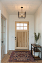 Mid-sized transitional light wood floor and brown floor entryway photo in Salt Lake City with white walls and a white front door