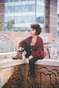 black curly hair woman listening music