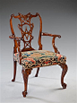 An elegant George II carved mahogany armchair.