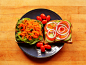 Vegetable sandwich on sprouted whole grain bread with spinach, green bell pepper, grated carrot, sliced cucumber, red bell pepper, red onion, hickory smoked tofurky, roasted garlic hummus, and vegan mayo. Grape tomatoes.