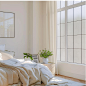 dingeedaniella_On_the_left_side_of_the_white_room_is_the_bed_an_ad5f133e-b0f5-4982-94ae-d20b470a2b1f