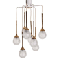 Stunning chandelier consists of eight arms with beautiful pressed glass drops. The combination of the brass stem, glass drops and random length of the stem makes it an eyecatcher!