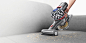Dyson V7™ handheld vacuum on upholstery.