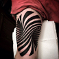 Bold Tattoo Doubles as a Mind-Bending Optical Illusion : Separately, we enjoy looking at tattoos and optical illusions, so this union is the best of both worlds. Paul O’Rourke of Allstar Ink in Limerick, Ireland created this clever tattoo that will defini