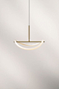 Interior designers Studio Truly Truly designed the Levity Pendant Light, a beautifully minimal and elegant light fixture available in brass or black.