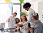 Happy colleagues celebrating at work medium shot Free Photo