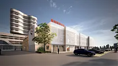 建筑立面上覆有穿孔铝板，底层则保留了原本的砖墙结构，形成了鲜明的对比。