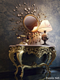 Love me some rococo, and mixed with the mod mirror, it is awesome.