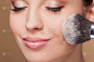 Pretty female model is receiving facial treatment