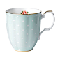 The 1930 Polka Rose Mug is decorated with the subtle combination of a pink-hued rose design and white polka dots on orchard apple green, with 9-karat gold trim edging.