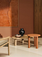 Orange circular and natural wood asymmetrical Ghia tables by Arper in a natural-toned living space[主动设计米田整理]