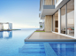 Luxury beach house with sea view swimming pool and empty terrace in modern design.