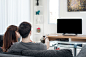 Young Asian couple waching movie on tv at home by Prasit Rodphan on 500px
