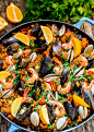 Chicken and Seafood Paella - a classic Spanish rice dish made with Arborio rice, packed with chicken, sausage, mussels, clams, shrimp and loaded with flavor.